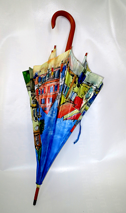 Das Bild zeigt den Regenschirm Lahr, auf dem bunte Aquarellmotive aus Lahr zu sehen sind.