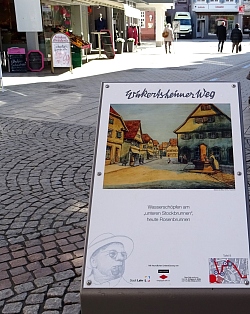 Gemälde von Wilhelm Wickertsheimer auf einer Stele in der Lahrer Innenstadt